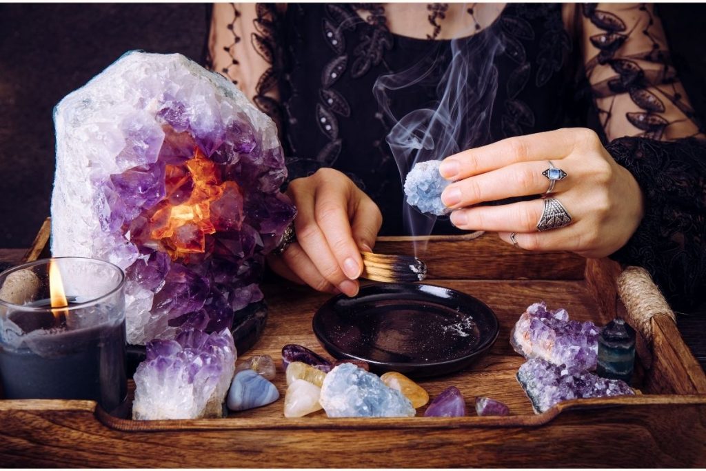 Cleansing Celestite Crystal by Palo Santo Smudging