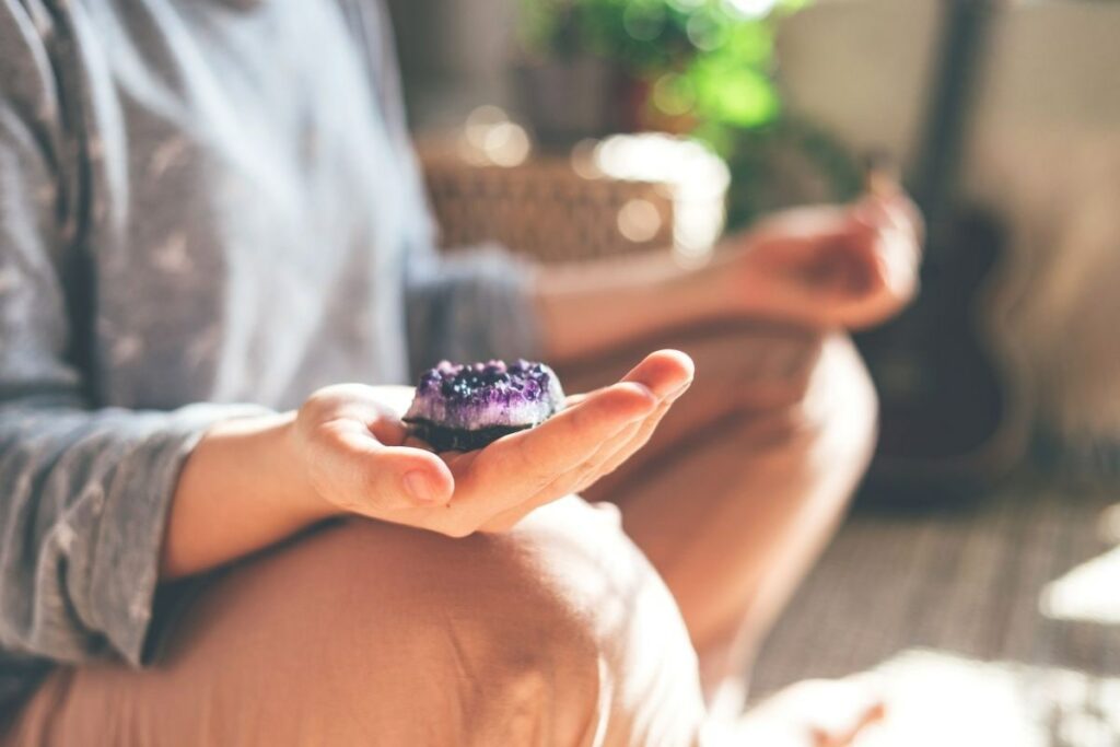 Meditating with Amethyst in Hand